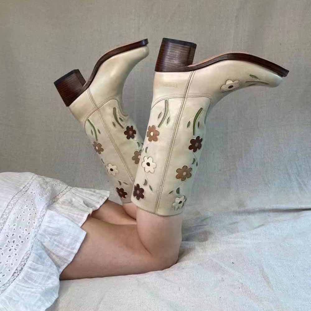Stylish floral embroidered boots in cream with brown wood heels, perfect for trendy outfits