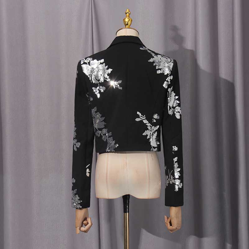 Back view of a black floral sequin crop top skirt set with stylish floral embellishments