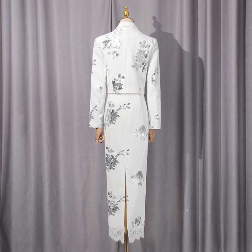 Back view of a floral sequin crop top skirt set featuring elegant floral patterns on a white fabric