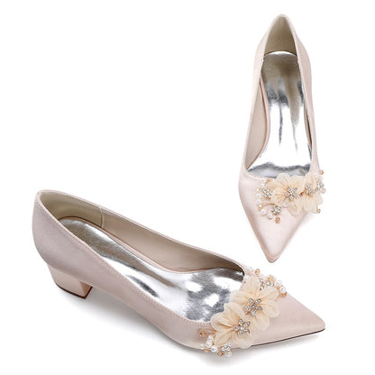 Elegant flower appliqué wedding heels with decorative beads and a pointed toe design