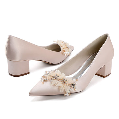 Elegant flower appliqué wedding heels in soft pink with decorative embellishments and a block heel
