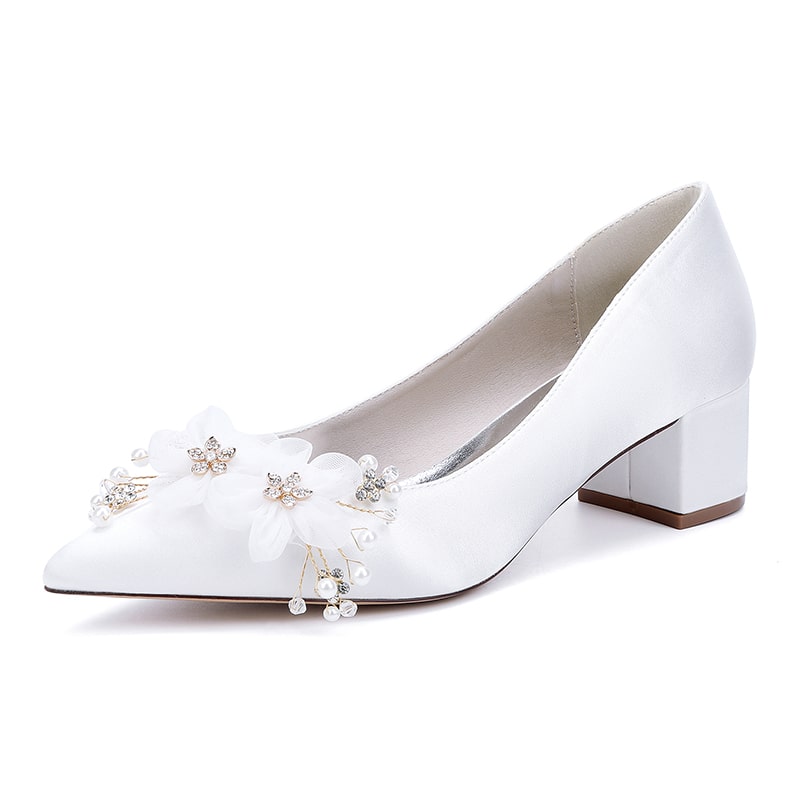 Elegant white flower appliqué wedding heels with decorative embellishments for brides