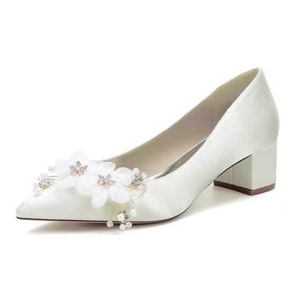 Elegant flower appliqué wedding heels in ivory with decorative embellishments for bridal wear