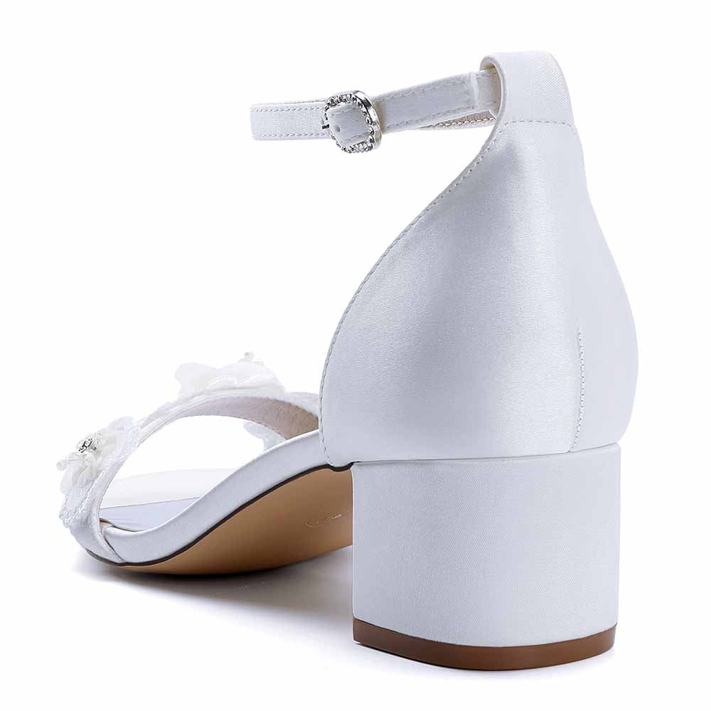 Elegant white flower appliqué wedding shoes with a comfortable block heel and ankle strap
