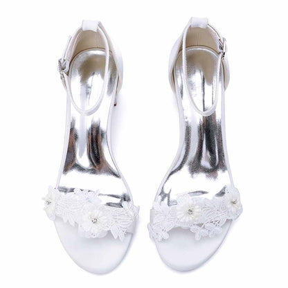 Elegant flower appliqué wedding shoes with silver accents and ankle strap for bridal wear