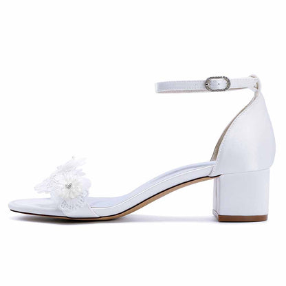 Elegant flower appliqué wedding shoes with ankle strap and block heel design for bridal footwear