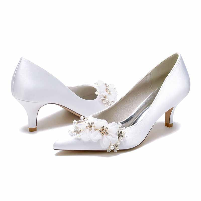 Elegant white flower embellished wedding shoes for bride with low heels for a perfect bridal look