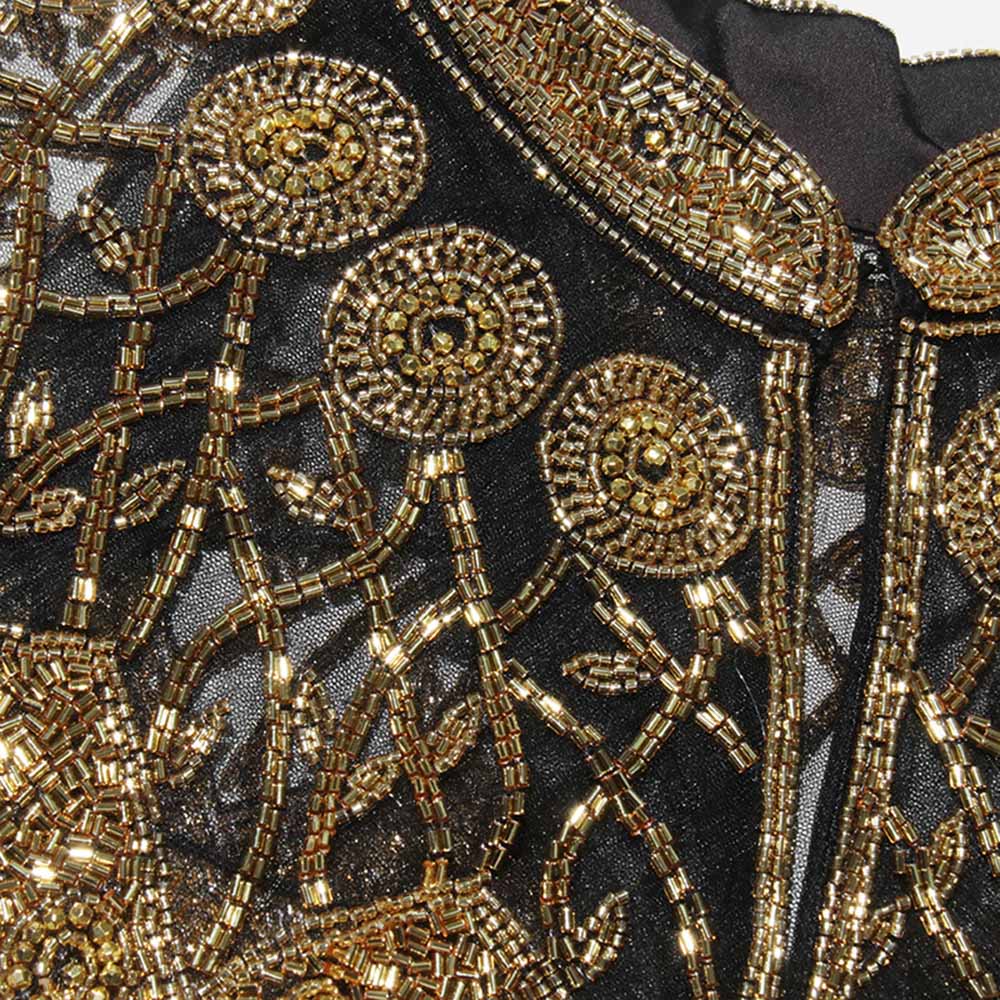 Elegant Gatsby style beaded fringe cape featuring intricate beadwork and floral designs