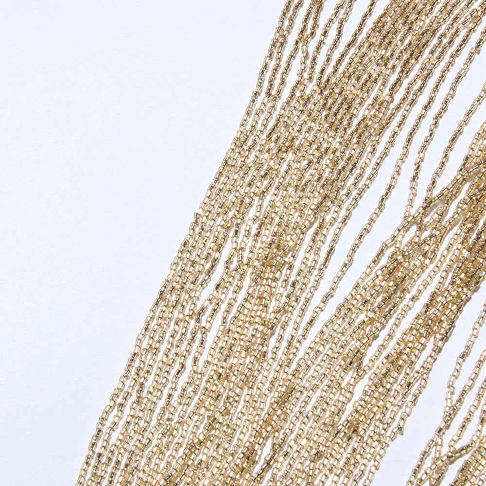 Gatsby style beaded fringe cape in gold with intricate beadwork and flowing design