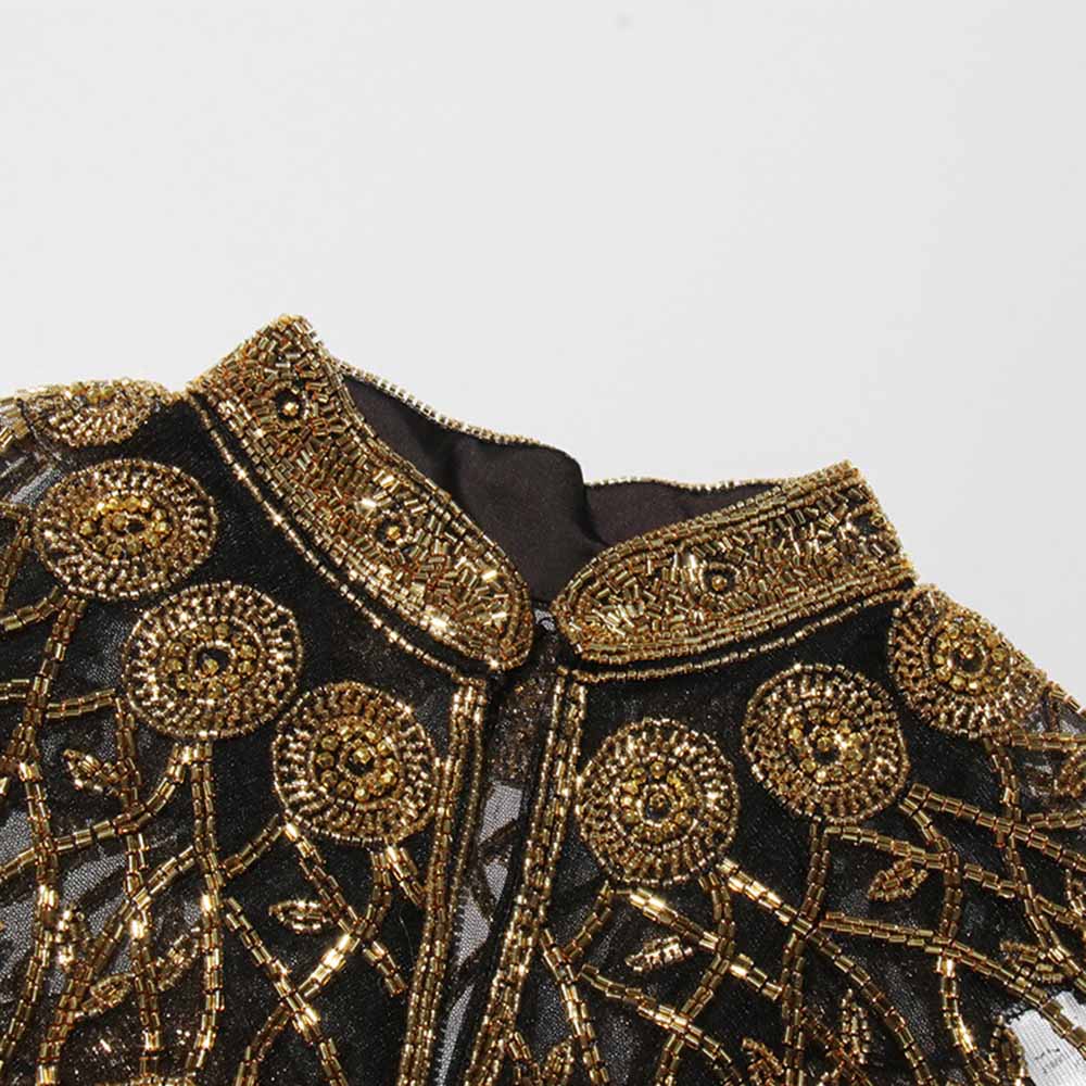 Elegant gatsby style beaded fringe cape with intricate gold bead detailing and a chic collar