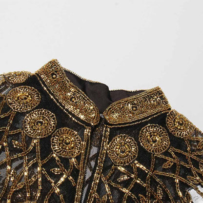 Elegant gatsby style beaded fringe cape with intricate gold bead detailing and a chic collar