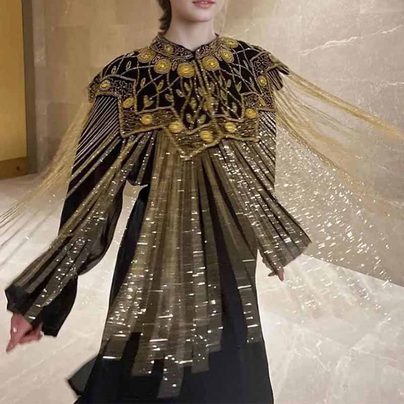 Elegant gatsby style beaded fringe cape featuring ornate designs and shimmering details