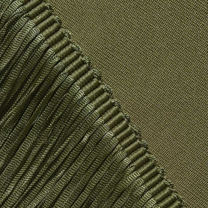 Close-up of luxurious fabric detail showcasing a glam party gown with tassel from SD Dresscode & Fashiontrends