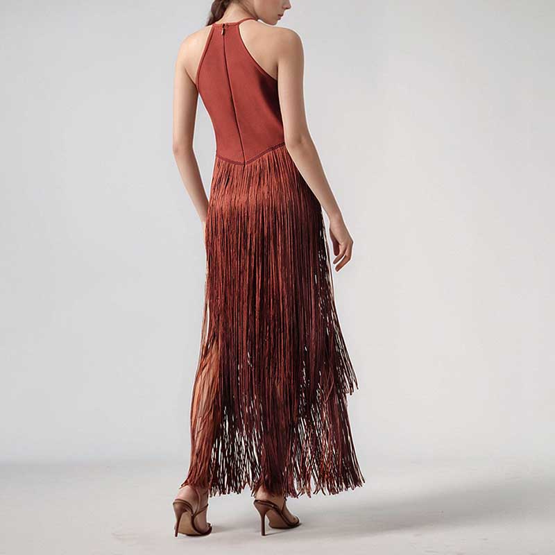 Back view of a glam party gown with tassel in rust color, showcasing a sleek design and elegant fringe detail.