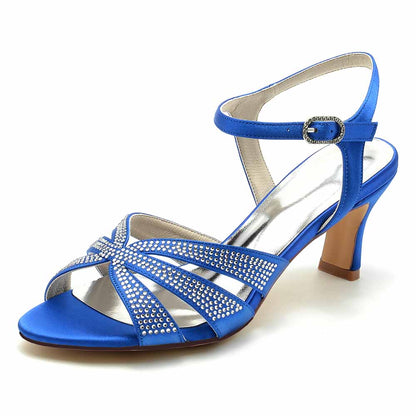 Blue glitter satin prom heels with decorative straps and a stylish ankle buckle for elegant occasions