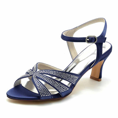 Blue glitter satin prom heels with crisscross design and ankle strap for elegant occasions