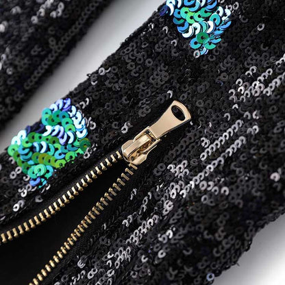 Close-up of the zipper detail on a green sequin mini dress with shiny sequins for added sparkle