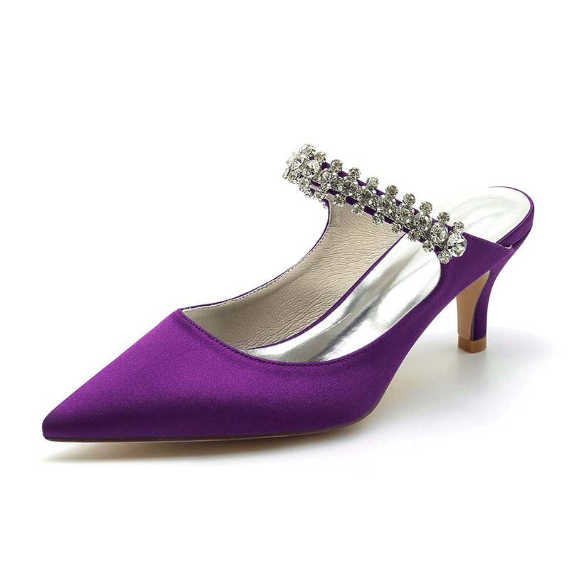 Purple high-heeled shoe with crystal embellishments on a white background