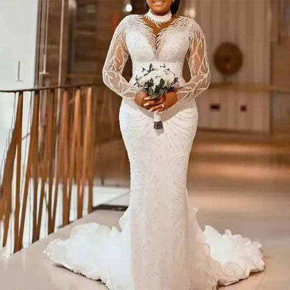 Elegant high neck glitter mermaid wedding dress with long sleeves and a fitted silhouette