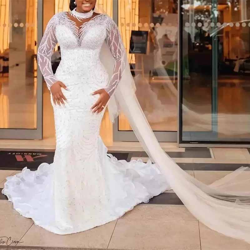 Elegant high neck glitter mermaid wedding dress by SD Dresscode & Fashiontrends with long sleeves and flowing train