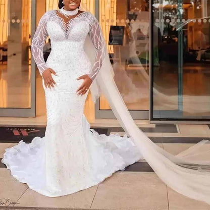 Elegant high neck glitter mermaid wedding dress by SD Dresscode & Fashiontrends with long sleeves and flowing train