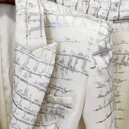 Ivory animal print suit for women featuring a stylish pattern and tailored design