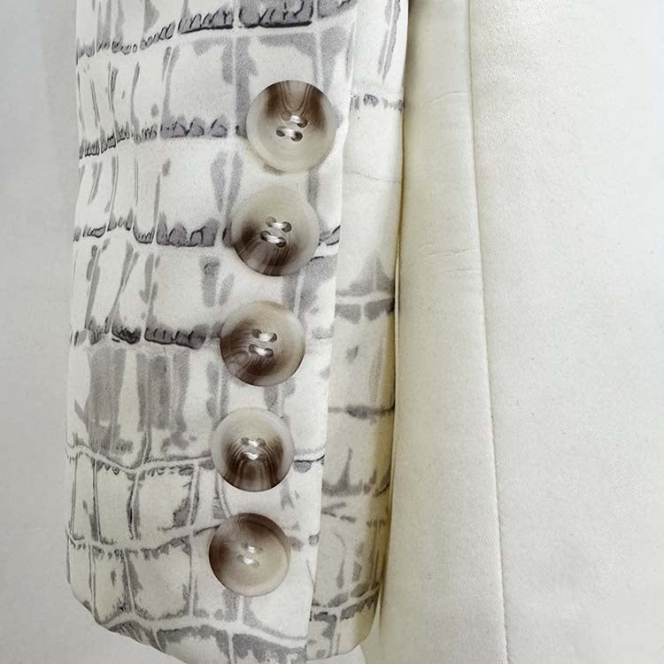 Close-up of ivory animal print suit for women showcasing elegant buttons and stylish fabric texture