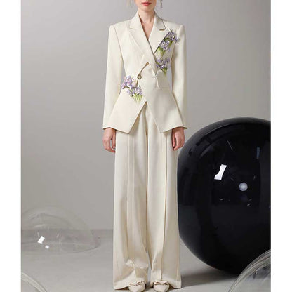 Ivory flower detail pantsuit for women featuring floral embellishments and a tailored silhouette