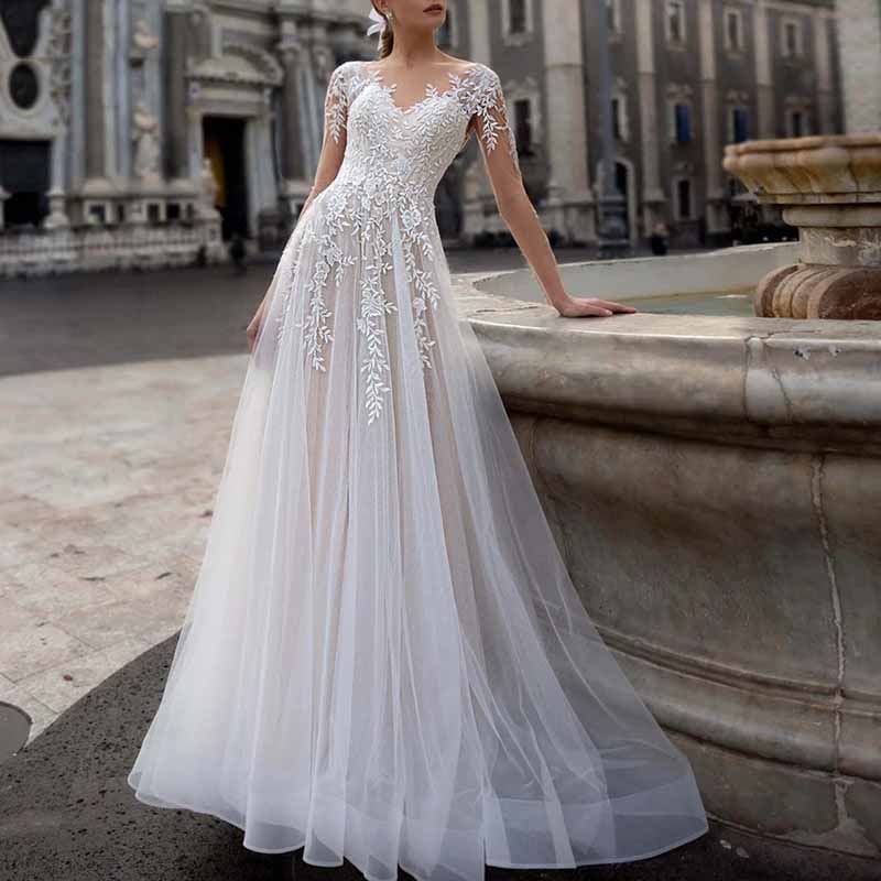 Elegant lace boho wedding dress with off-the-shoulder sleeves and floral embroidery