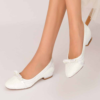 Elegant lace bridal flats with bow, perfect for weddings and special occasions