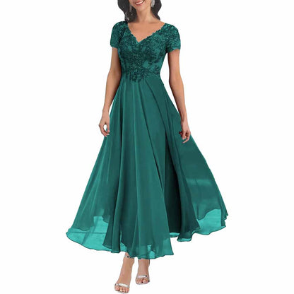 Elegant lace mother of the bride dress with sleeves in teal featuring a flowing skirt and floral embellishments