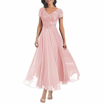 Elegant lace mother of the bride dress with sleeves in soft pink featuring a flowing skirt