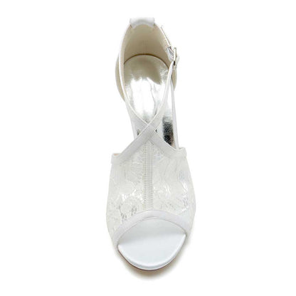 White lace peep toe bridal shoes with elegant design and ankle strap for a stylish wedding look