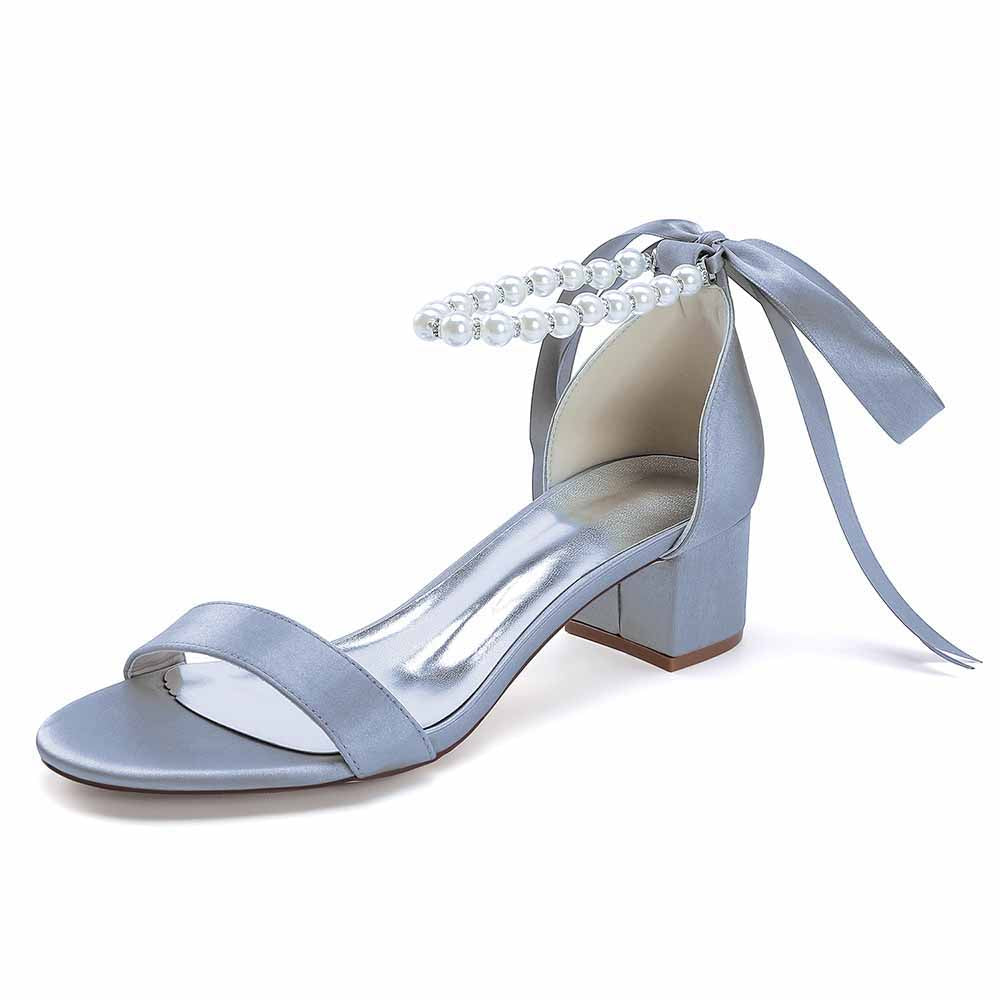 Elegant blue lace up chunky heel dress shoes with pearl detail and ribbon ties for stylish occasions