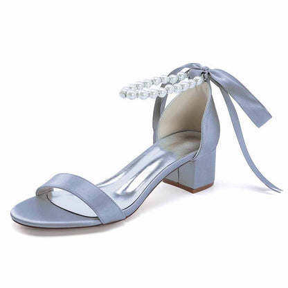 Elegant blue lace up chunky heel dress shoes with pearl detail and ribbon ties for stylish occasions