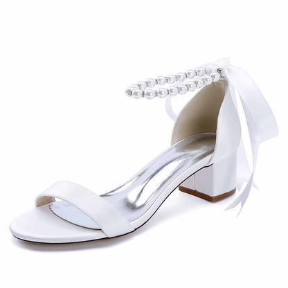 White lace up chunky heel dress shoes with pearl accent and ribbon for elegant occasions