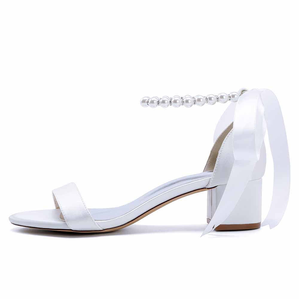 Elegant lace up chunky heel dress shoes in white satin with pearl details and stylish ribbon ties