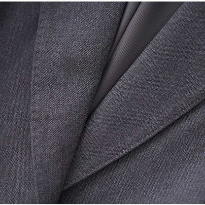 Close-up of a ladies tailored pantsuit for events highlighting fine fabric details and elegant design