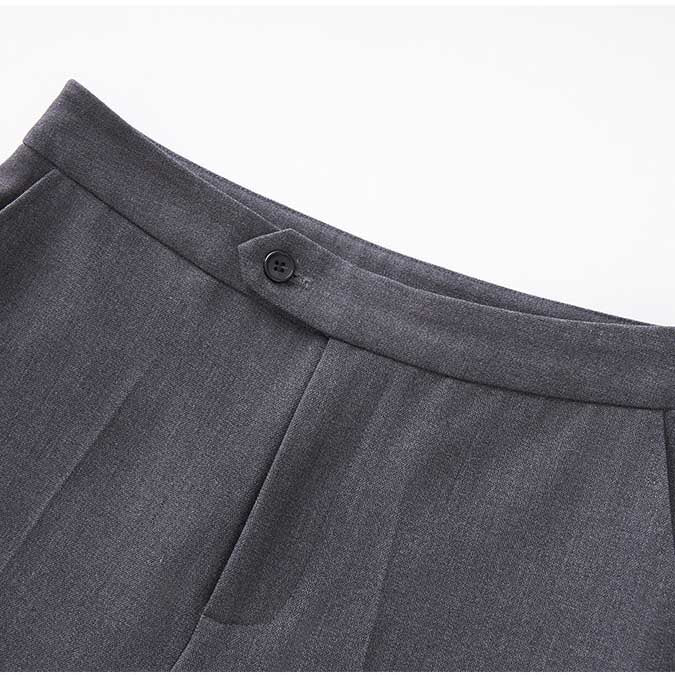 Close-up of a ladies tailored pantsuit for events showing a stylish waistband detail