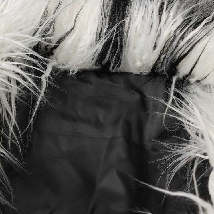 Inside view of a long faux fur coat for women showing soft lining and texture details