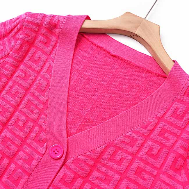 Bright pink long knitted cardigan set with geometric pattern and button closure for stylish layering