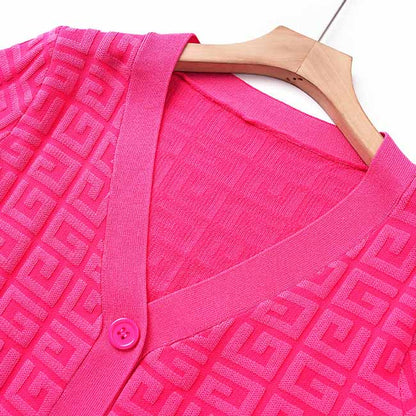 Bright pink long knitted cardigan set with geometric pattern and button closure for stylish layering