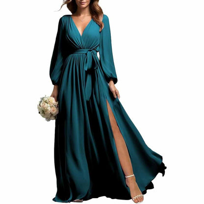 Elegant teal long sleeve chiffon bridesmaid dress with V-neck and side slit holding bouquet