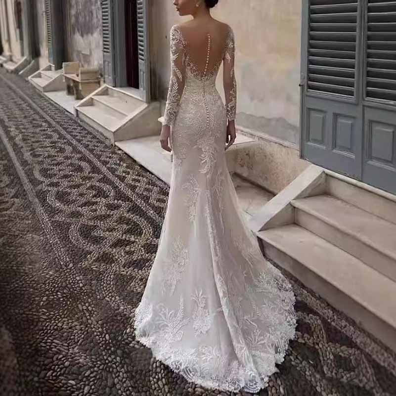 Elegant long sleeve lace mermaid wedding dress featuring intricate floral details and a stunning back design