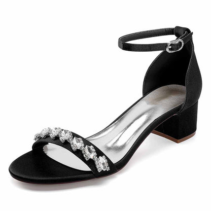 Elegant black low block heel dress sandals for wedding with rhinestone embellishment and adjustable ankle strap