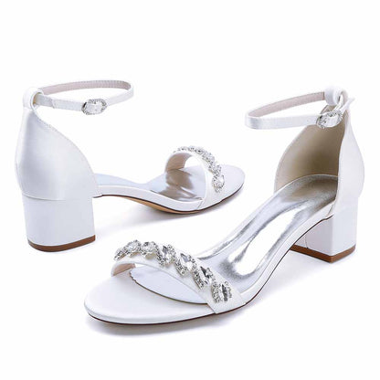 Elegant low block heel dress sandals for wedding with a sparkling beaded design and ankle strap