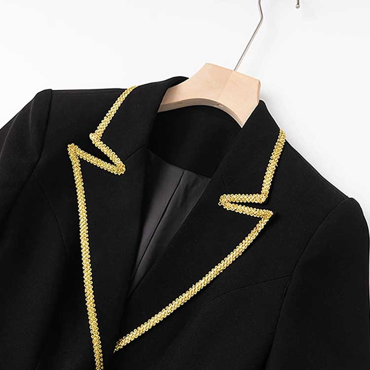 Elegant luxury black skirt suit for weddings featuring gold trim on the collar and lapels