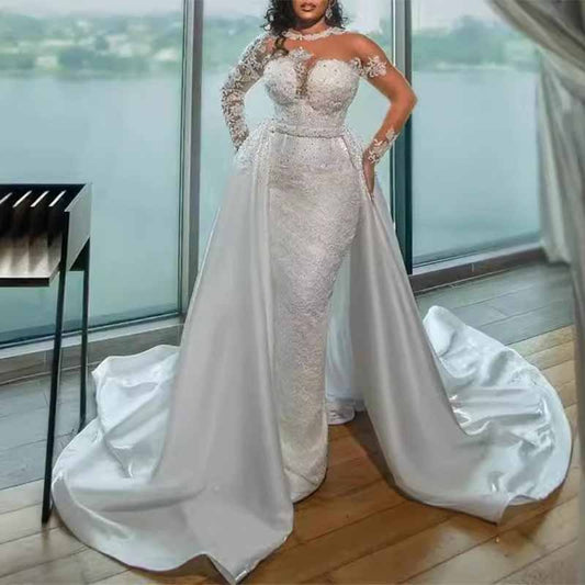 Elegant luxury lace mermaid wedding dress featuring a stunning off-the-shoulder design and flowing train.