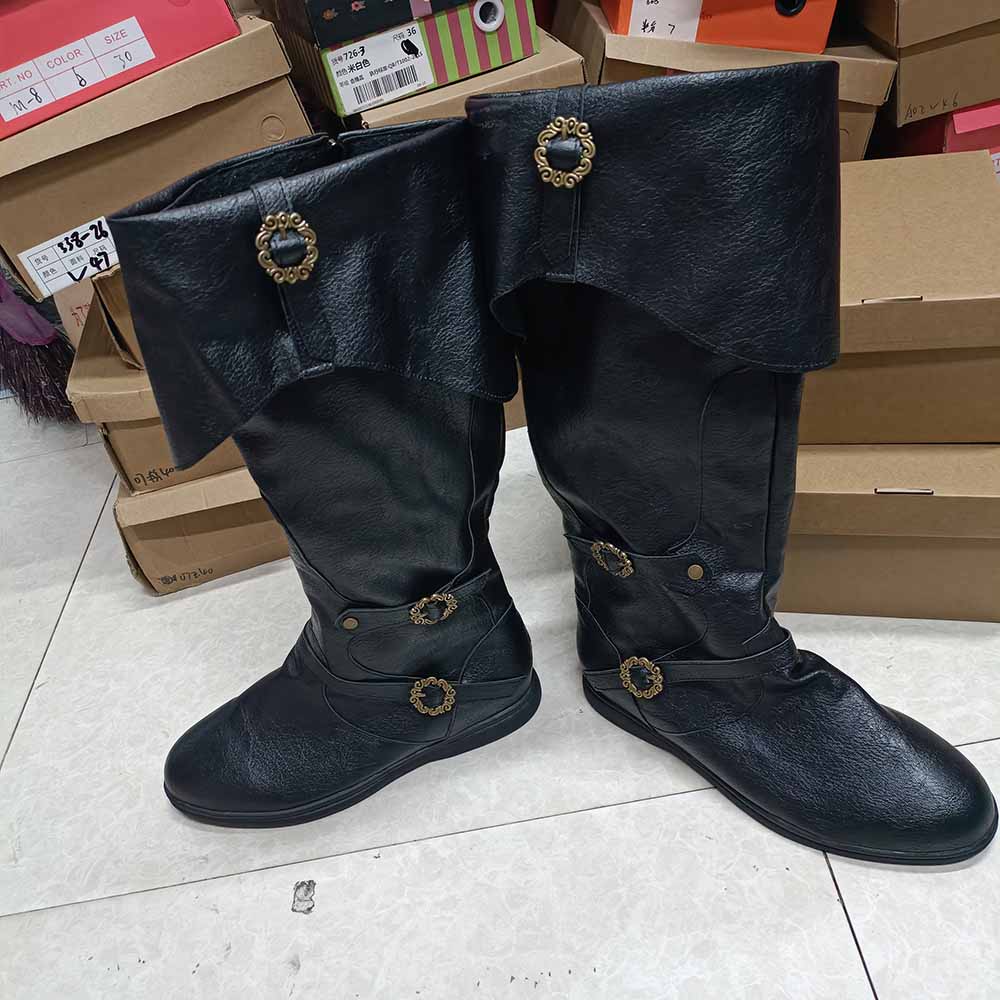 Black medieval renaissance flat boots with decorative buttons and a stylish folded top design