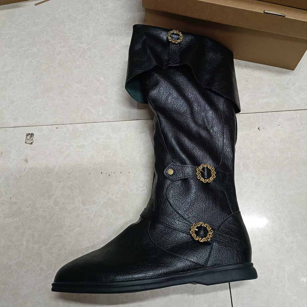 Black medieval renaissance flat boots with decorative gold buckles and a stylish slouch design